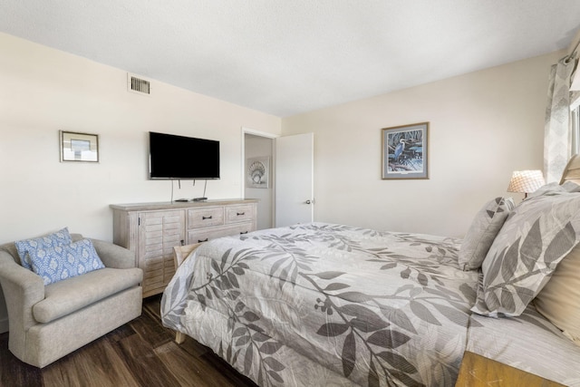 bedroom featuring dark wood-type flooring