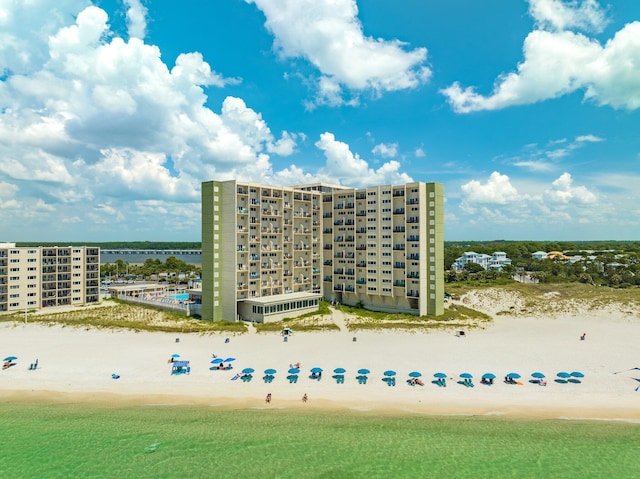 exterior space featuring a beach view and a water view