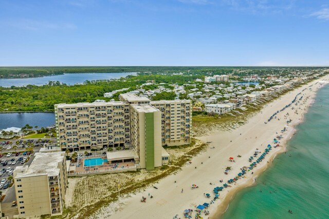 bird's eye view with a water view and a view of the beach