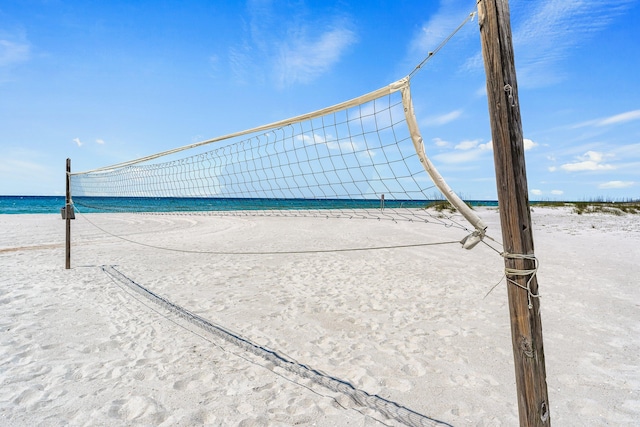 view of home's community featuring a water view and volleyball court