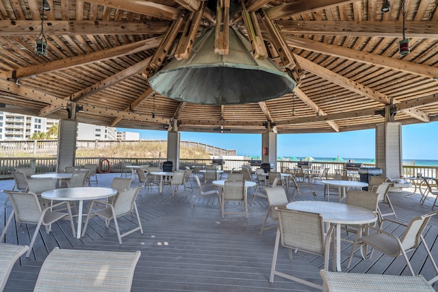 wooden terrace featuring a gazebo