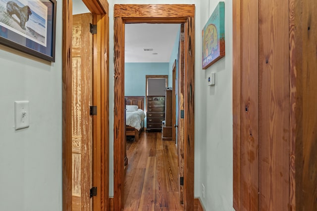 corridor featuring dark hardwood / wood-style flooring