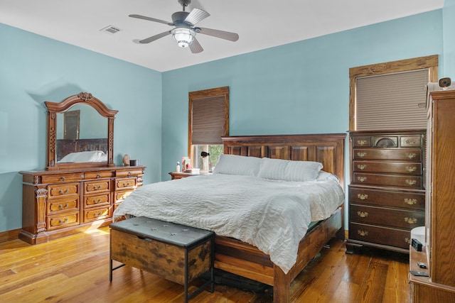 bedroom with hardwood / wood-style floors and ceiling fan