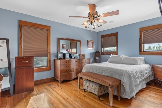 bedroom featuring light hardwood / wood-style flooring and ceiling fan