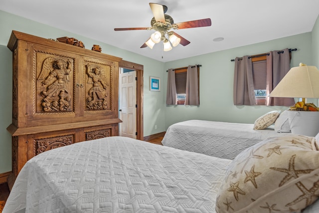 bedroom with ceiling fan and light hardwood / wood-style floors