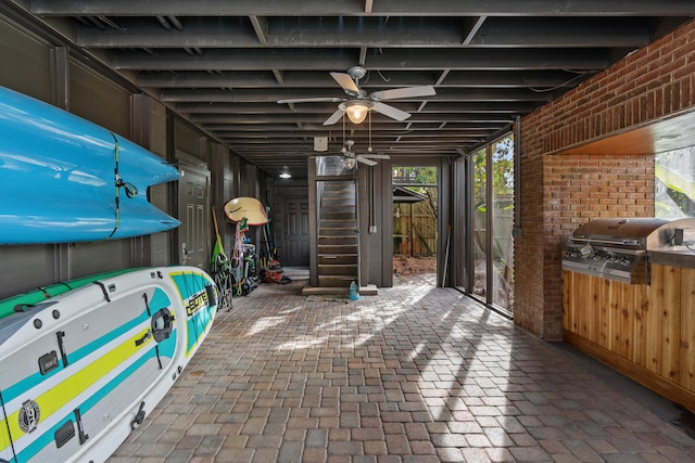 view of patio / terrace featuring ceiling fan, exterior kitchen, and grilling area