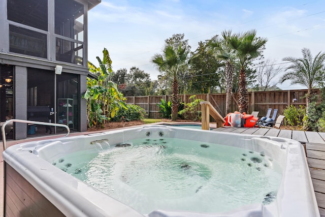 view of pool featuring an outdoor hot tub