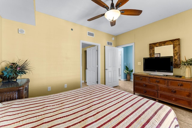 bedroom featuring visible vents, ceiling fan, and light tile patterned flooring