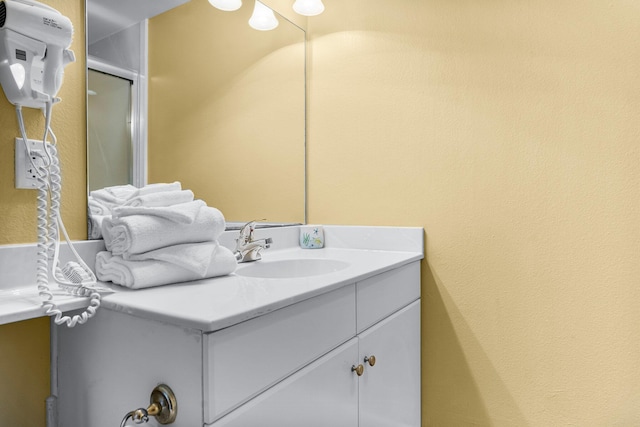 bathroom with vanity and an enclosed shower