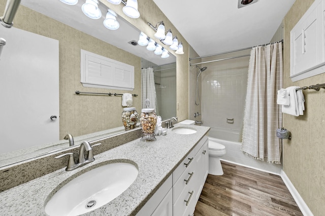 full bathroom featuring hardwood / wood-style floors, shower / bath combination with curtain, toilet, and large vanity