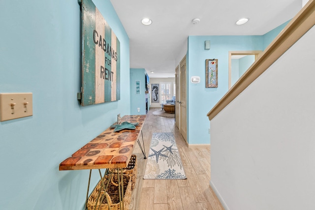 hallway with light wood-type flooring