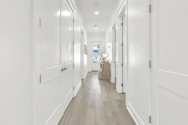 hall with light hardwood / wood-style floors