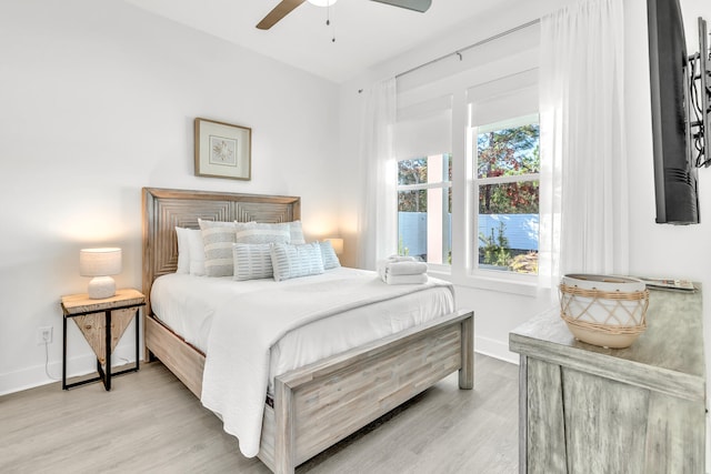 bedroom featuring light hardwood / wood-style flooring and ceiling fan