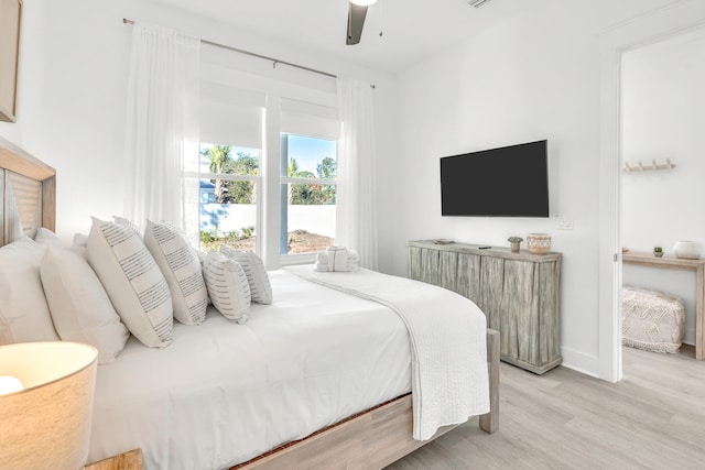 bedroom featuring light hardwood / wood-style flooring and ceiling fan