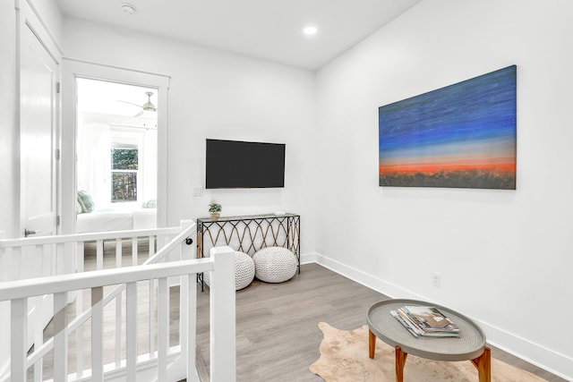 bedroom featuring light hardwood / wood-style flooring and a crib