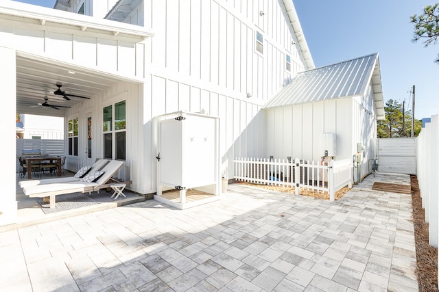 back of property featuring a patio and ceiling fan