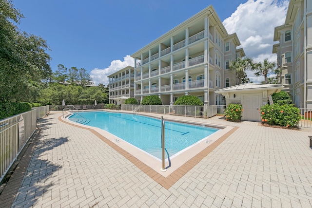 view of swimming pool featuring a patio area