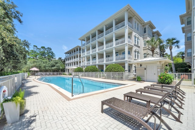 view of swimming pool featuring a patio area