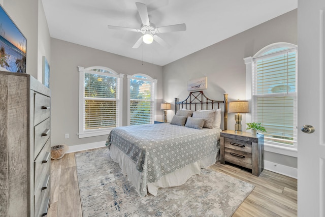 bedroom featuring ceiling fan and light wood-type flooring