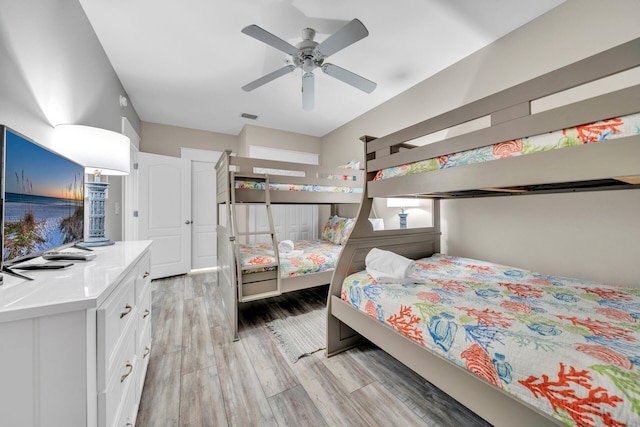 bedroom featuring light hardwood / wood-style flooring and ceiling fan