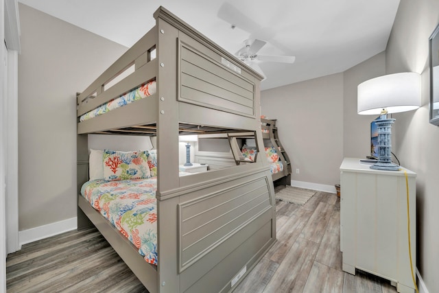 bedroom featuring wood-type flooring and ceiling fan