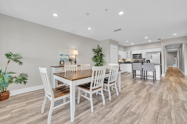 dining area with light wood-type flooring