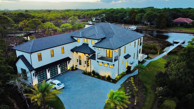 birds eye view of property featuring a water view