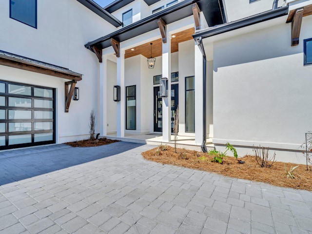 330 Kelly Plantation Dr, Destin, FL 32541 - property entrance featuring stucco siding and decorative driveway