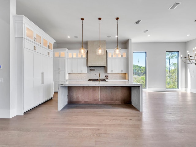330 Kelly Plantation Dr, Destin, FL 32541 - kitchen featuring light wood-style flooring, light countertops, white cabinets, and recessed lighting