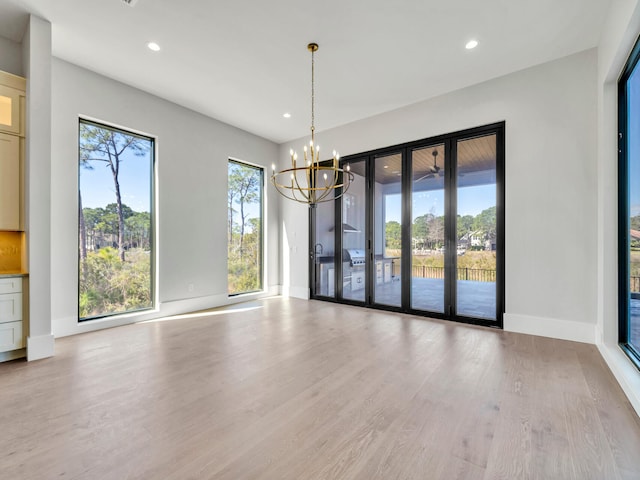 330 Kelly Plantation Dr, Destin, FL 32541 - unfurnished dining area featuring wood finished floors, a chandelier, recessed lighting, and baseboards