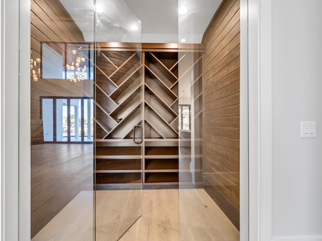 330 Kelly Plantation Dr, Destin, FL 32541 - wine area with wood walls, wood finished floors, and recessed lighting