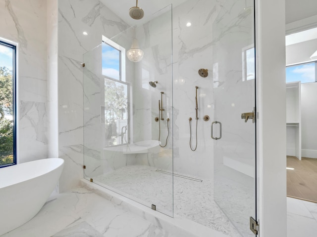 330 Kelly Plantation Dr, Destin, FL 32541 - full bathroom featuring a marble finish shower, a freestanding bath, and marble tiled flooring