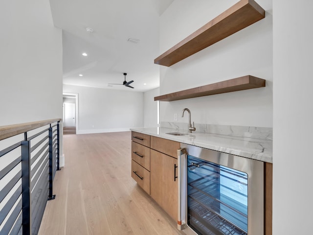 330 Kelly Plantation Dr, Destin, FL 32541 - indoor wet bar with wine cooler, light wood-type flooring, recessed lighting, ceiling fan, and baseboards