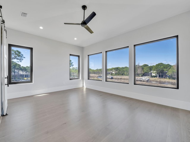 330 Kelly Plantation Dr, Destin, FL 32541 - unfurnished room featuring a ceiling fan, wood finished floors, recessed lighting, and baseboards