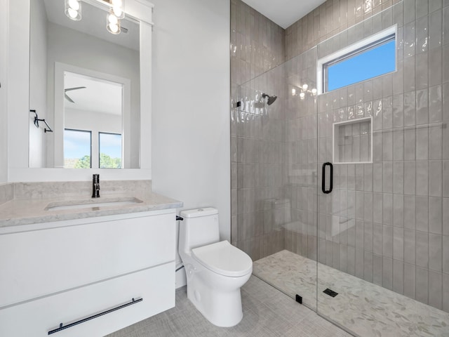 330 Kelly Plantation Dr, Destin, FL 32541 - full bathroom with a tile shower, vanity, toilet, and tile patterned floors