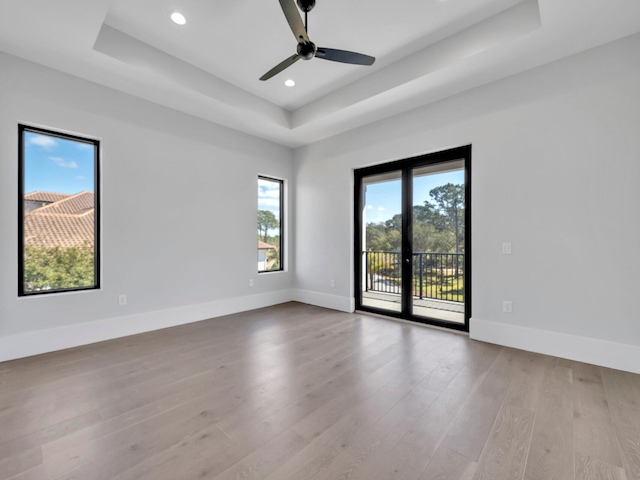 330 Kelly Plantation Dr, Destin, FL 32541 - spare room with a raised ceiling, wood finished floors, baseboards, recessed lighting, and a ceiling fan