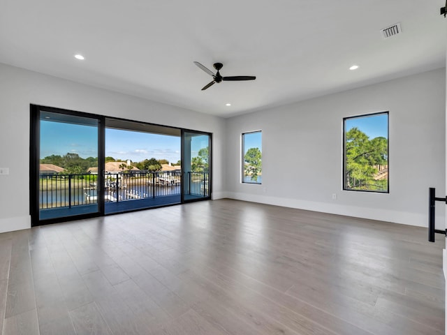 330 Kelly Plantation Dr, Destin, FL 32541 - unfurnished room with a ceiling fan, wood finished floors, recessed lighting, and baseboards