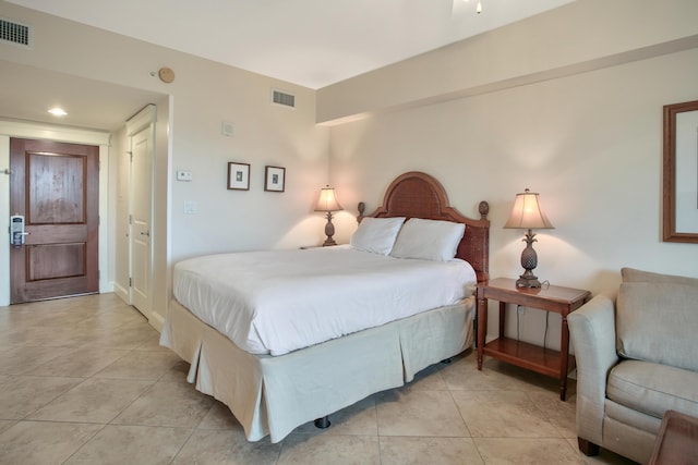 bedroom with light tile floors