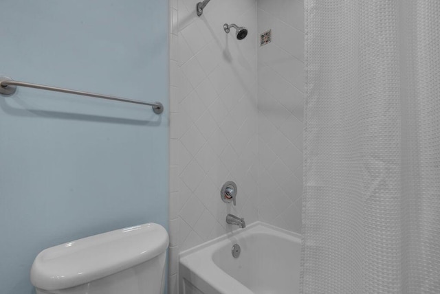 bathroom with toilet and shower / bathtub combination with curtain