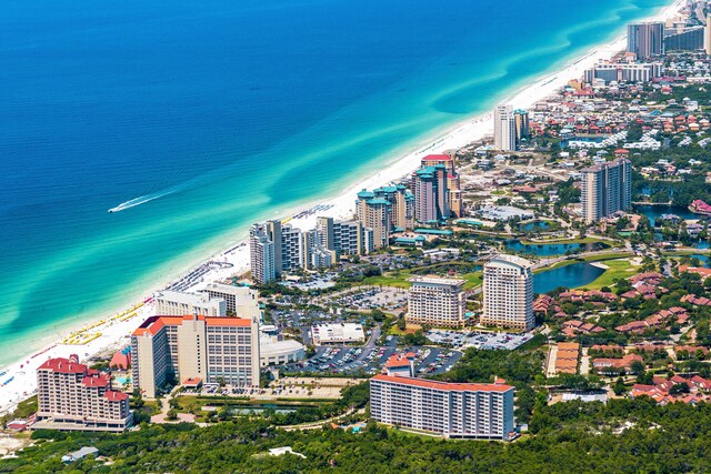 birds eye view of property featuring a view of the beach and a water view