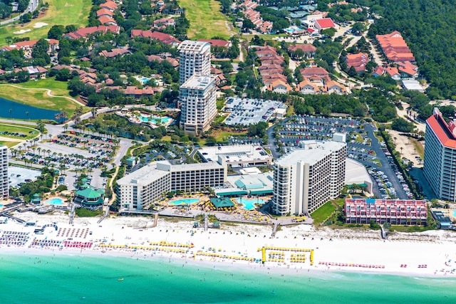 aerial view with a water view and a beach view