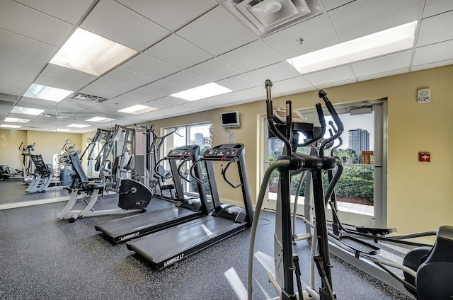 exercise room featuring a paneled ceiling