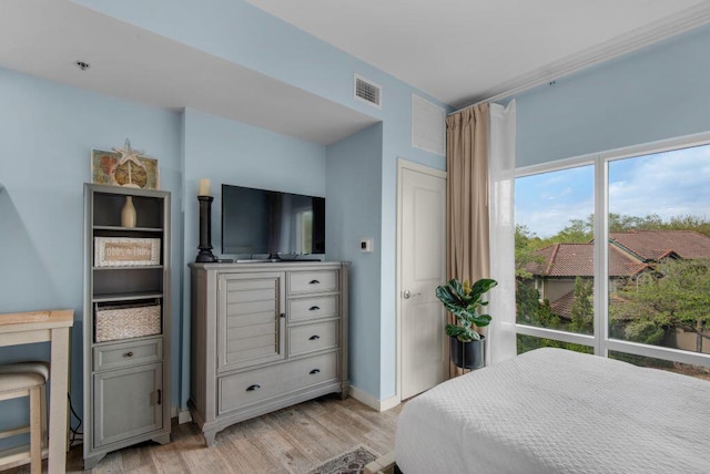 bedroom featuring light hardwood / wood-style floors