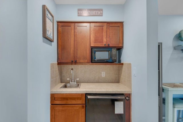 kitchen with tile countertops, sink, tasteful backsplash, and dishwashing machine