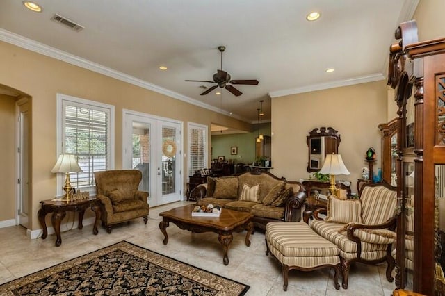 living room with french doors, ceiling fan, crown molding, and light tile flooring