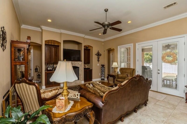 living room featuring french doors, ceiling fan, crown molding, and light tile floors