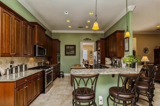 kitchen featuring appliances with stainless steel finishes, light tile flooring, light stone counters, pendant lighting, and a breakfast bar