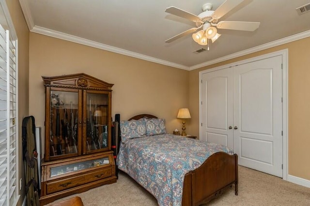 bedroom with light colored carpet, ceiling fan, and a closet