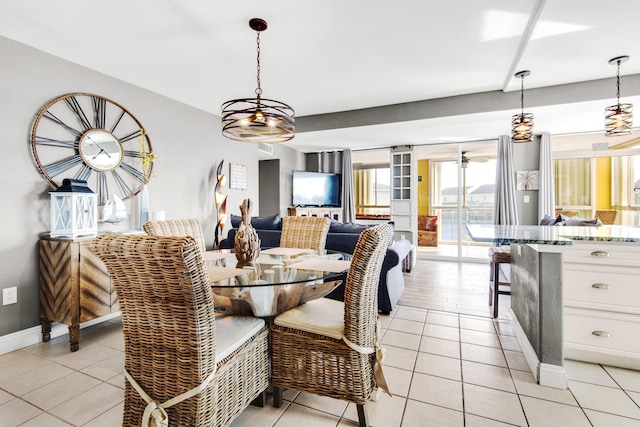 dining area with light tile flooring and an inviting chandelier