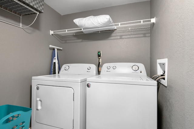 laundry room featuring washer hookup and separate washer and dryer